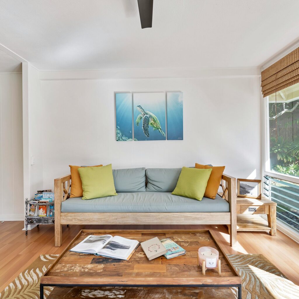 Stylish living room with natural light and nature view, perfect for relaxation.